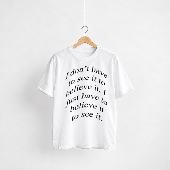 Believe white unisex graphic T-shirt — front view on a hanger