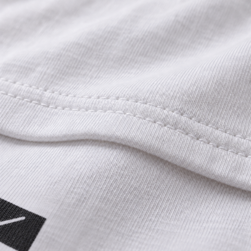 All She Wrote white unisex graphic T-shirt — fabric and print close-up