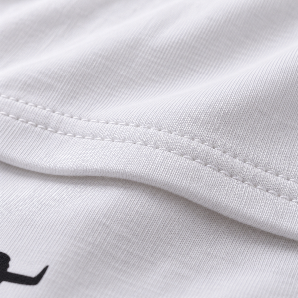 Pushing Luck unisex graphic T-shirt — fabric closeup