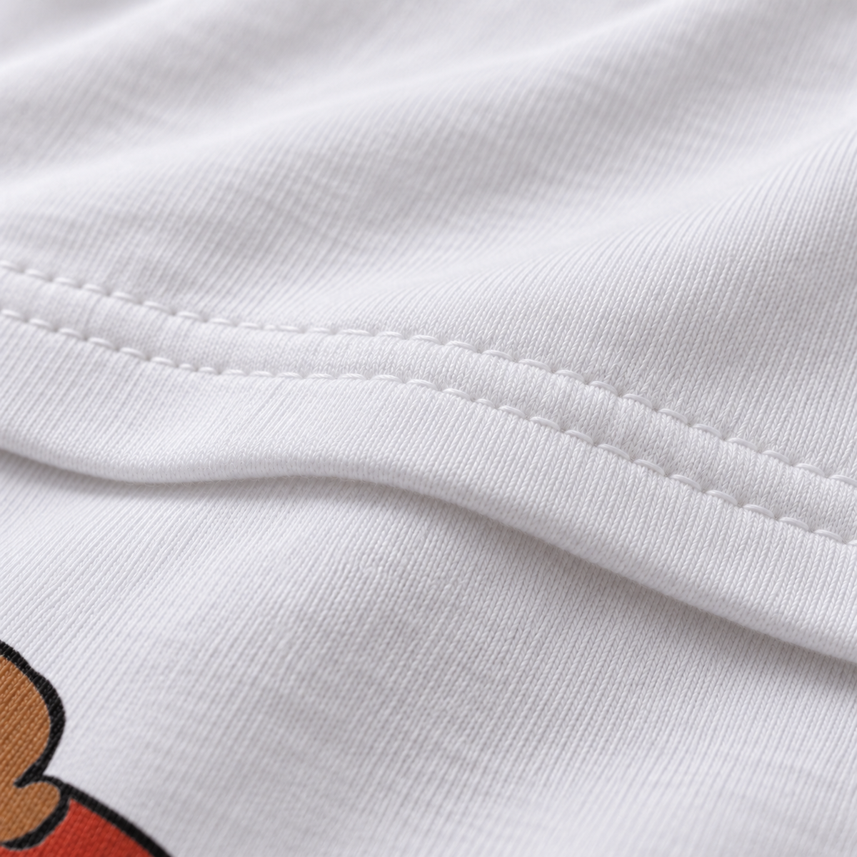 Show me your tits unisex graphic T-shirt — fabric closeup