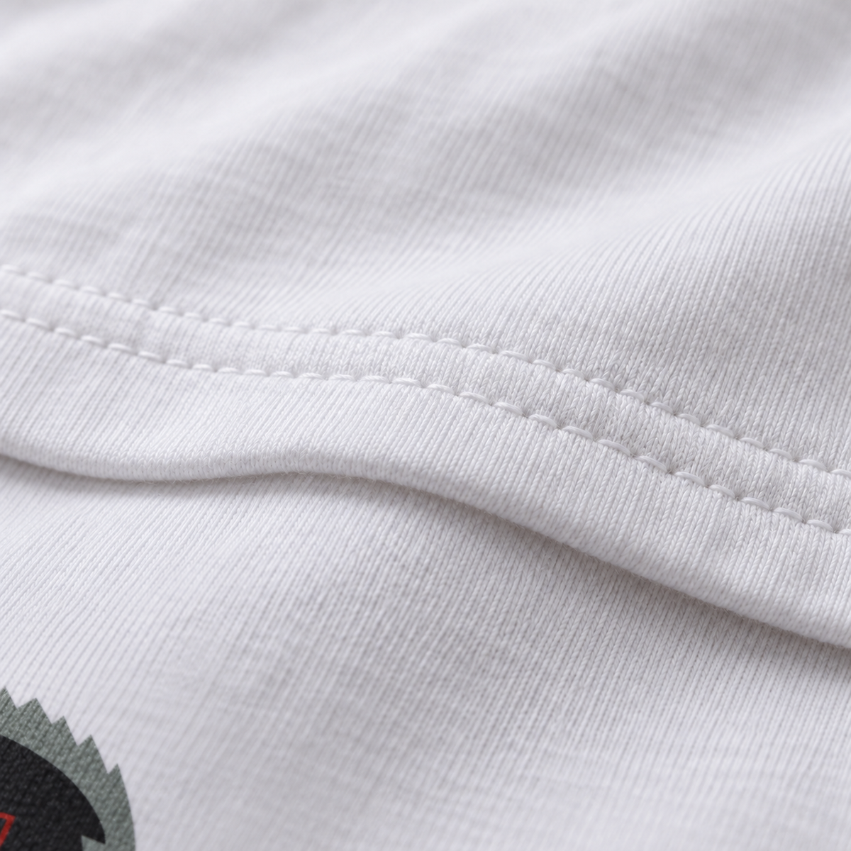 Bear Hug white unisex graphic T-shirt — fabric and print close-up