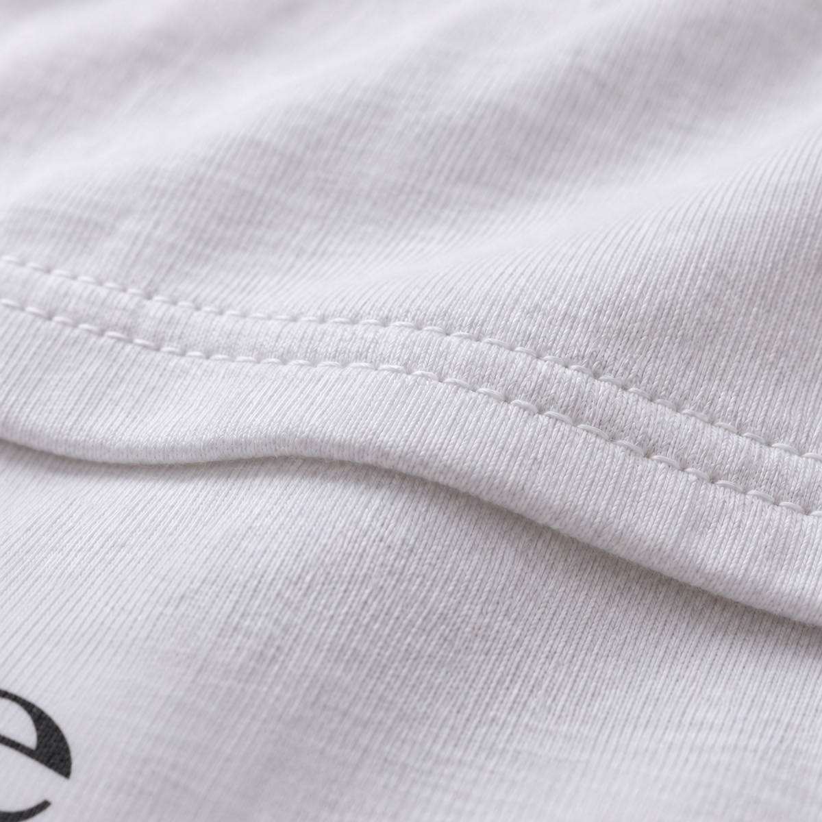 Believe white unisex graphic T-shirt — fabric and print close-up