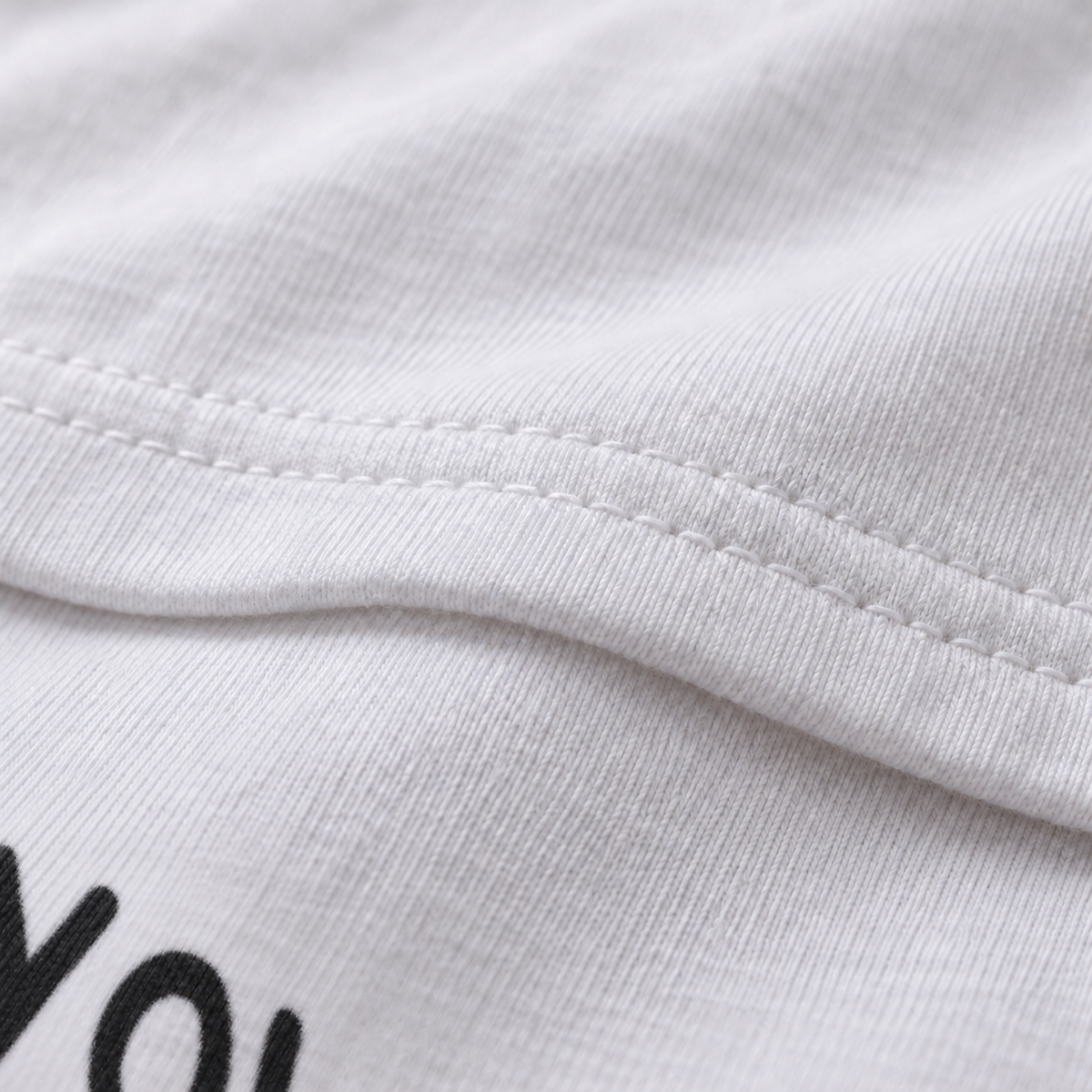 Caller #10 white unisex graphic T-shirt — fabric and print close-up
