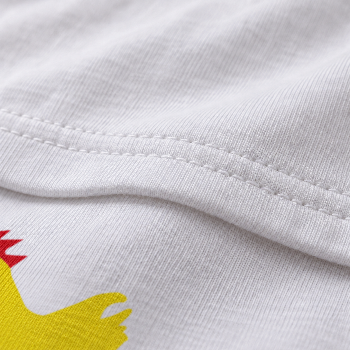 Chicken Shit white unisex graphic T-shirt — fabric and print close-up