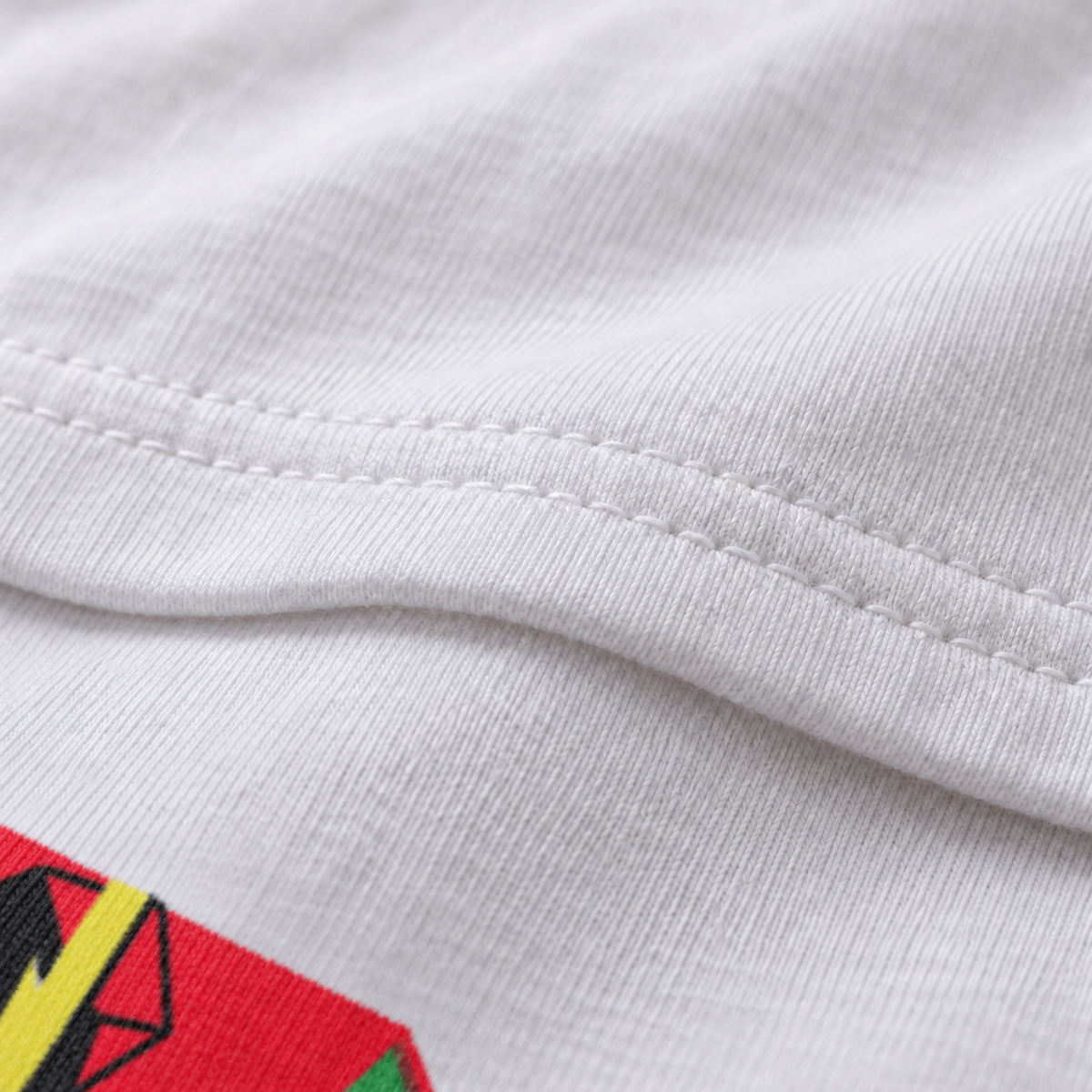 House Broken white unisex graphic T-shirt — fabric and print close-up