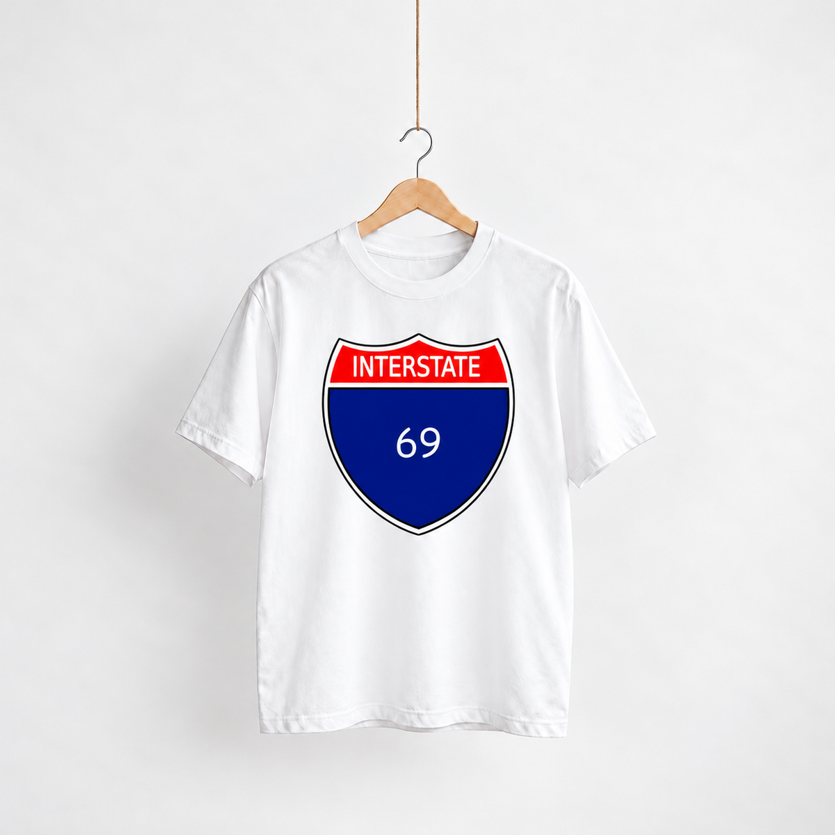 Highway 69 white unisex graphic T-shirt — front view on a hanger