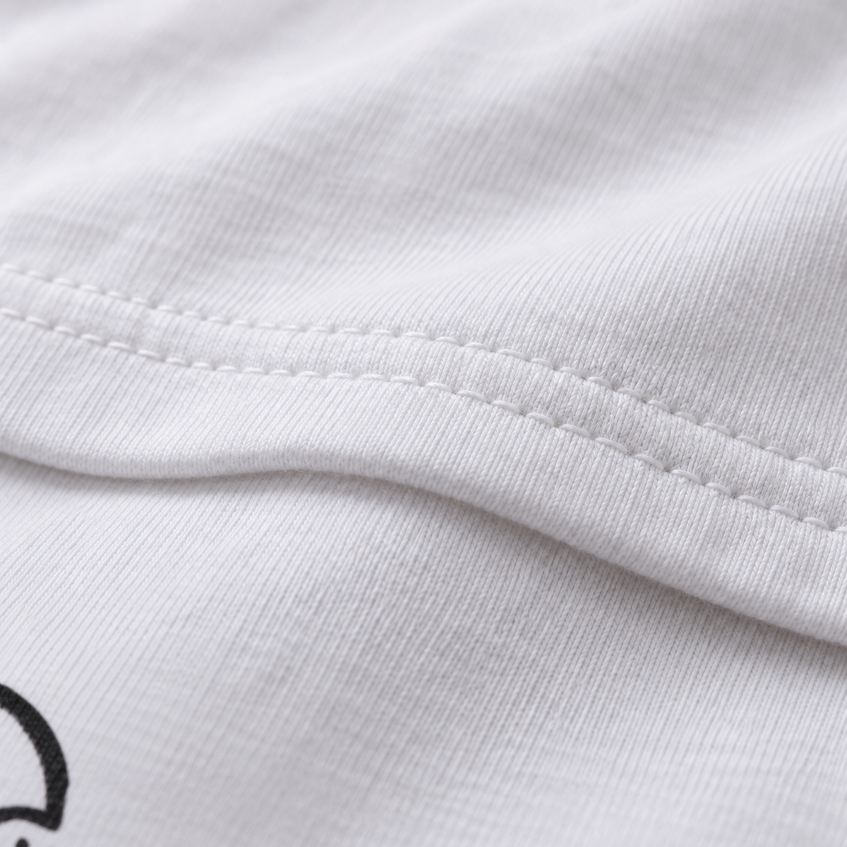 No Brainer white unisex graphic T-shirt — fabric and print close-up